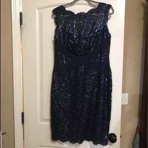Navy lace evening dress embellished with sequins.